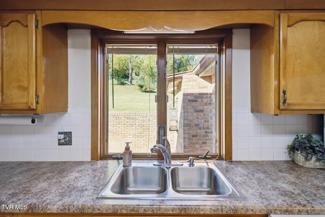 kitchen with sink and backsplash