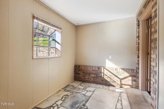 unfurnished room featuring crown molding