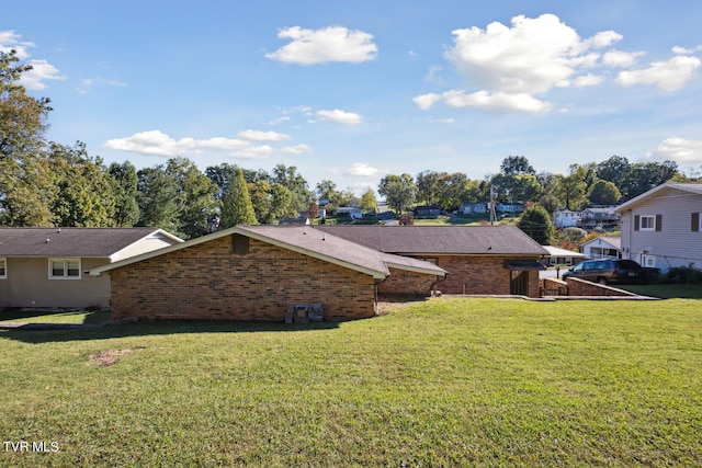 view of property exterior featuring a lawn