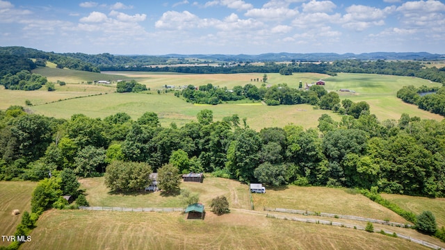 birds eye view of property with a rural view