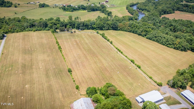 birds eye view of property featuring a rural view and a water view