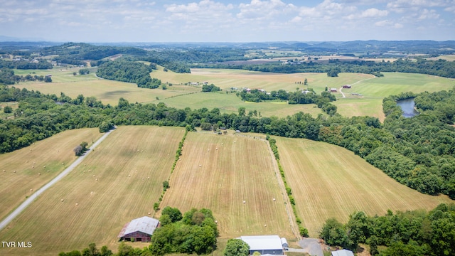 birds eye view of property with a rural view