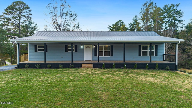 view of front of house featuring a front yard and covered porch