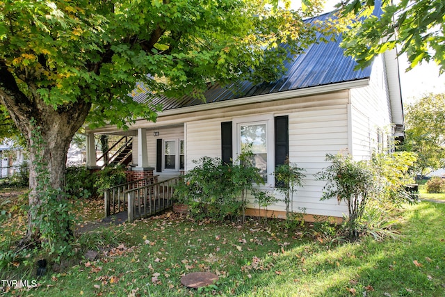 view of outbuilding with a yard