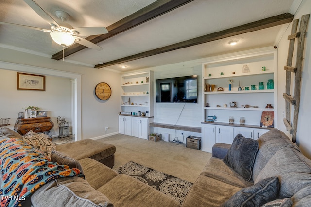 living room with beam ceiling, carpet flooring, a textured ceiling, built in shelves, and ceiling fan