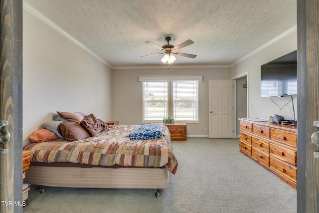 carpeted bedroom featuring crown molding, a textured ceiling, and ceiling fan