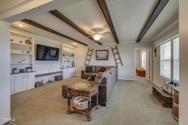 living room featuring beam ceiling, light carpet, a textured ceiling, and built in features