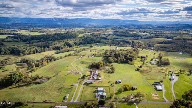 drone / aerial view with a mountain view and a rural view