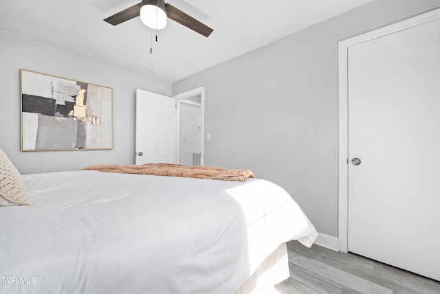 bedroom featuring light hardwood / wood-style floors and ceiling fan