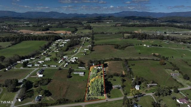 bird's eye view featuring a mountain view and a rural view