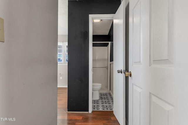 hall featuring dark wood-type flooring