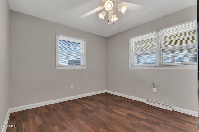 unfurnished room featuring ceiling fan, a baseboard radiator, plenty of natural light, and dark hardwood / wood-style floors