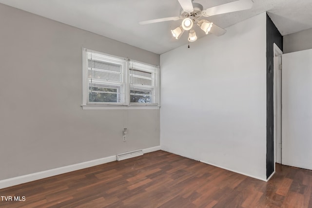 spare room with ceiling fan and dark hardwood / wood-style flooring