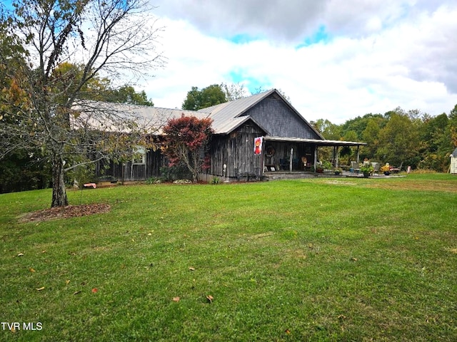 7503 Strawberry Mountain Rd, Wise, VA 24293 - rear view of property featuring a lawn and metal roof