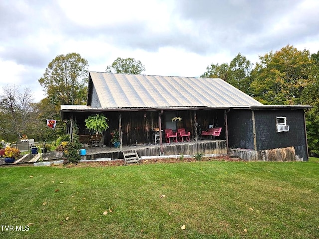 back of house featuring a yard