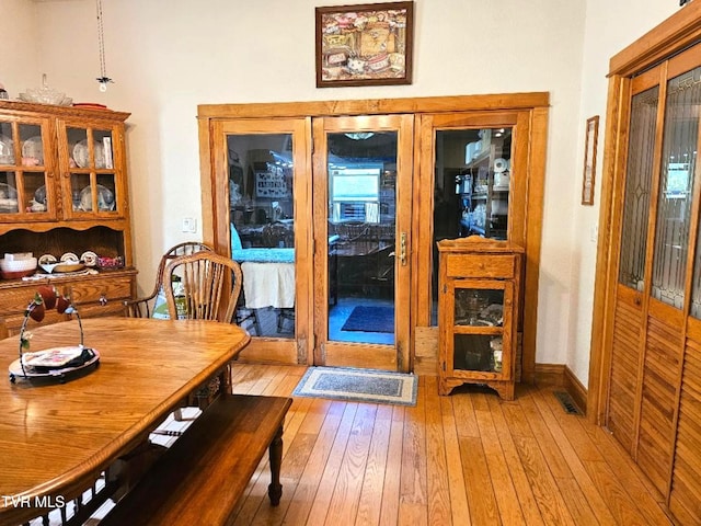 dining area with light hardwood / wood-style floors