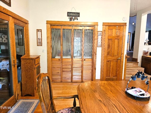 dining space with hardwood / wood-style floors