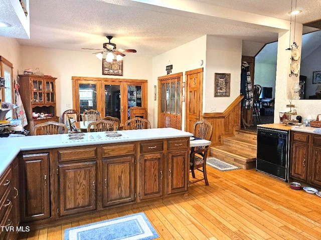 kitchen with wine cooler, ceiling fan, white gas stovetop, a textured ceiling, and light wood-type flooring