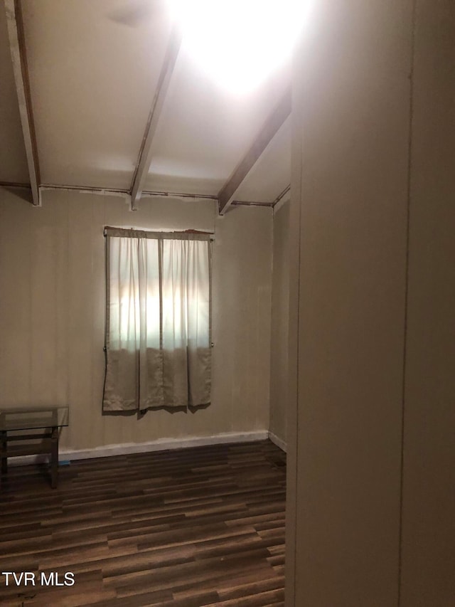 spare room with dark hardwood / wood-style floors