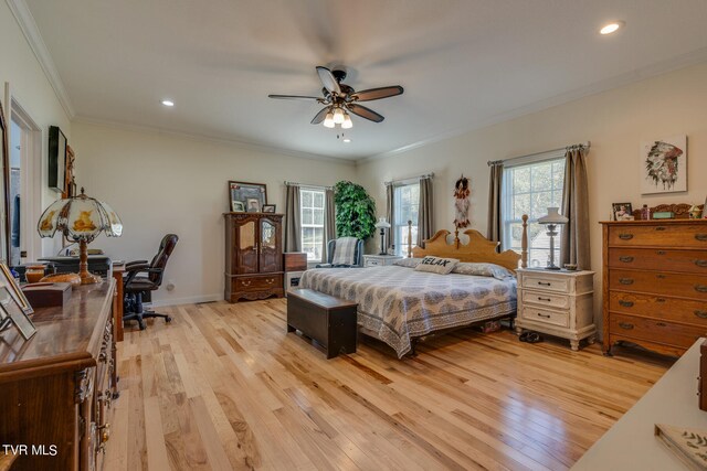 bedroom with light hardwood / wood-style floors, ornamental molding, and ceiling fan