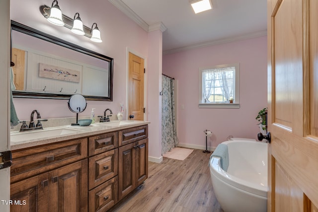 bathroom with vanity, ornamental molding, shower with separate bathtub, and hardwood / wood-style flooring