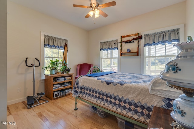 bedroom featuring hardwood / wood-style floors and ceiling fan