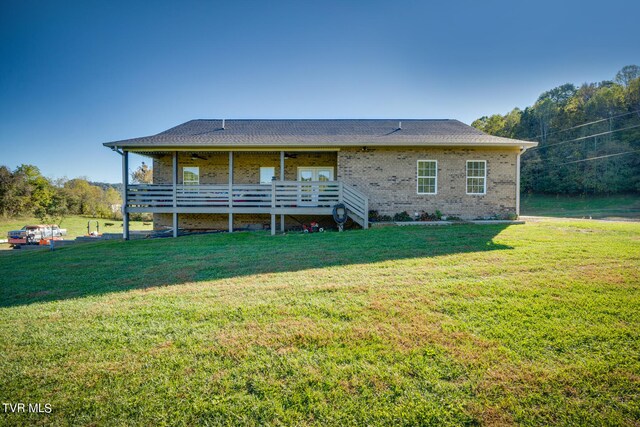 back of house with a yard