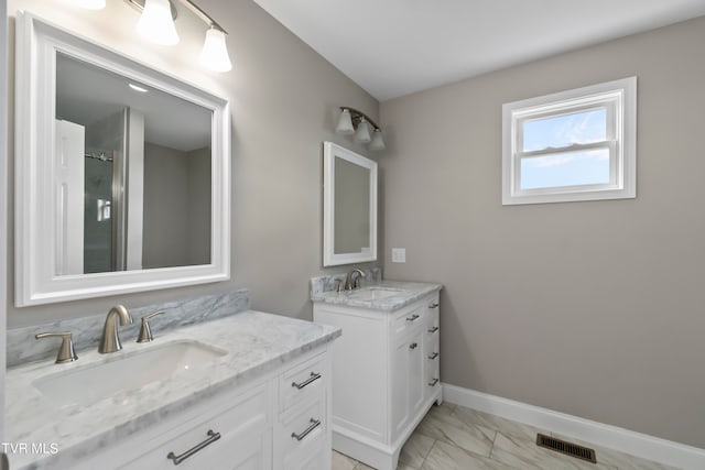 bathroom featuring vanity and an enclosed shower