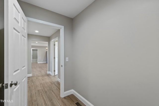 hallway with light wood-type flooring