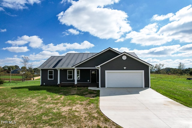 view of front of home featuring a garage and a front lawn