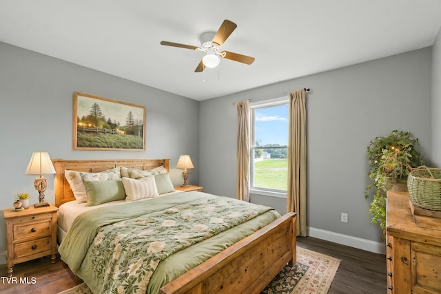 bedroom with ceiling fan and dark wood-type flooring