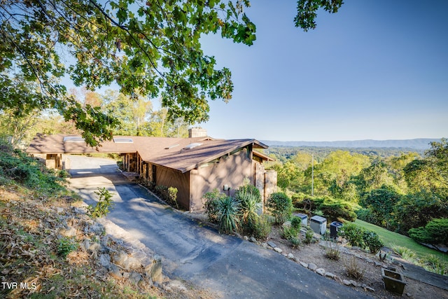 view of side of home with a garage