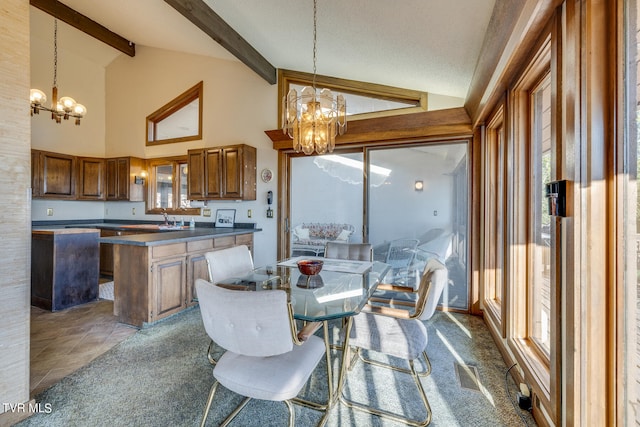 carpeted dining area featuring an inviting chandelier, beam ceiling, a healthy amount of sunlight, and sink