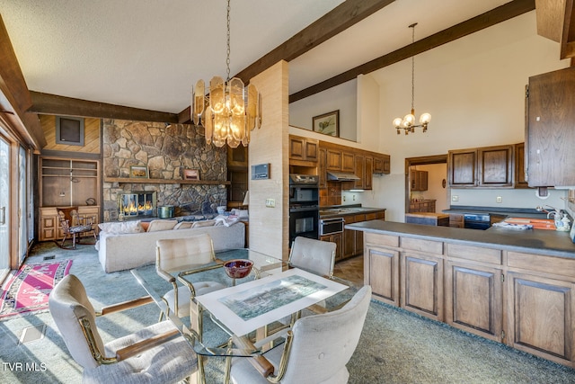 carpeted dining area with high vaulted ceiling, beamed ceiling, a fireplace, a notable chandelier, and sink