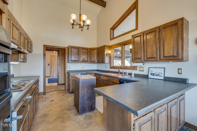 kitchen with beam ceiling, sink, an inviting chandelier, stainless steel gas stovetop, and high vaulted ceiling