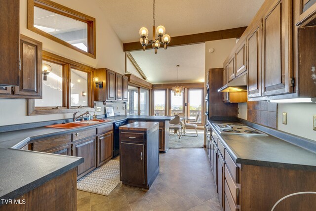 kitchen with dishwasher, sink, hanging light fixtures, and stainless steel gas stovetop