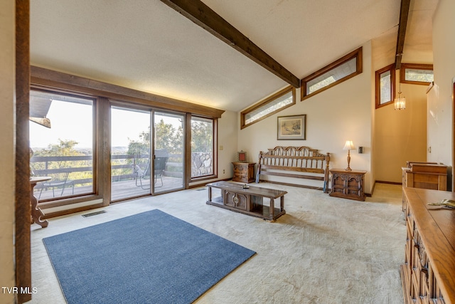 carpeted living room featuring a textured ceiling and vaulted ceiling with beams