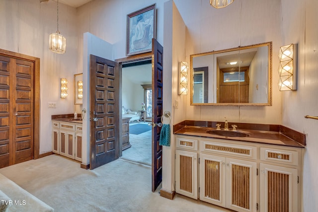 bathroom with vanity and a high ceiling