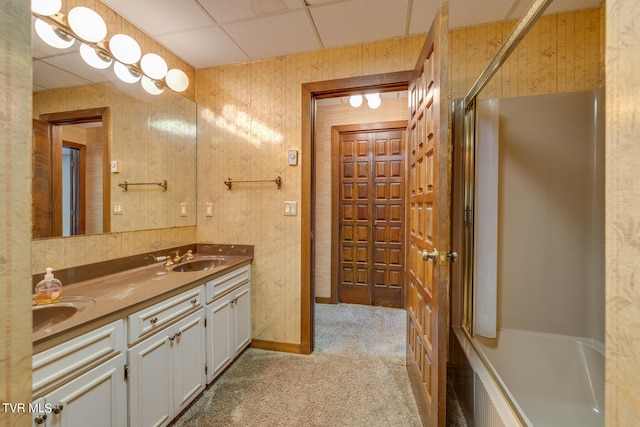 bathroom with vanity, a paneled ceiling, and bathing tub / shower combination