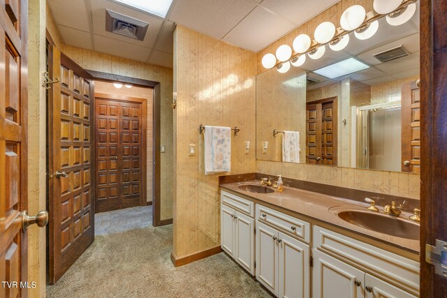 bathroom with vanity and a drop ceiling