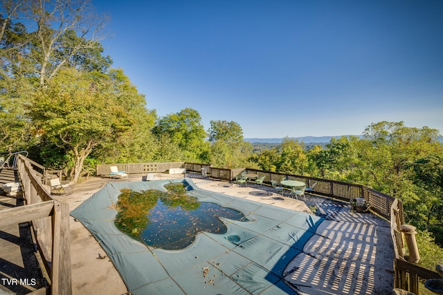 view of pool featuring a patio area