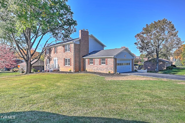 exterior space with a front yard and a garage