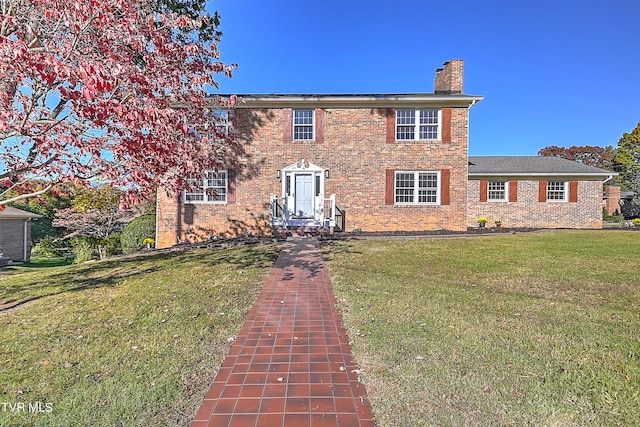 colonial home with a front yard