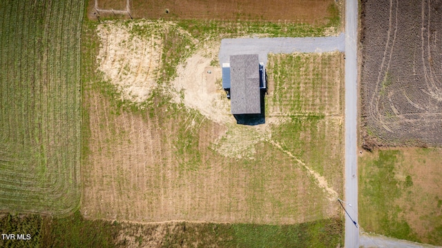 birds eye view of property with a rural view