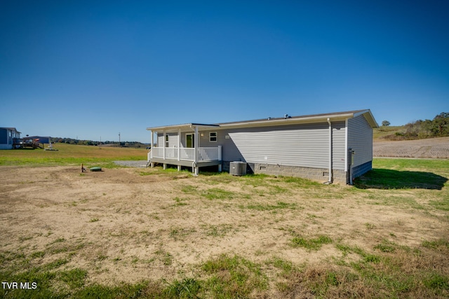 back of house featuring central AC unit