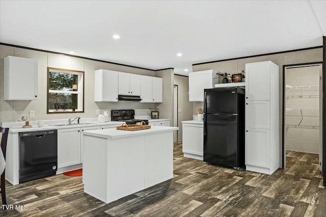 kitchen featuring white cabinets, a center island, dark hardwood / wood-style floors, and black appliances