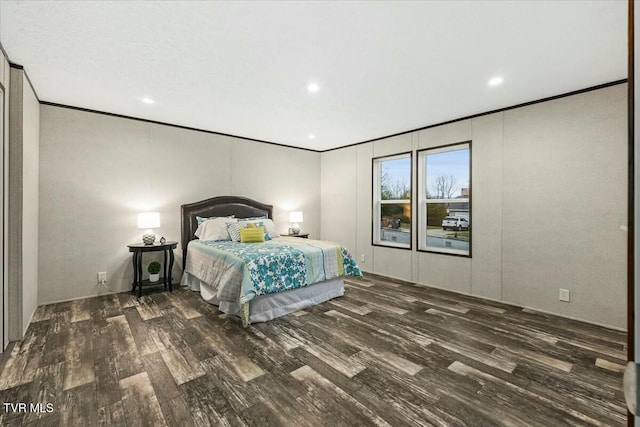 unfurnished bedroom with dark hardwood / wood-style flooring and crown molding