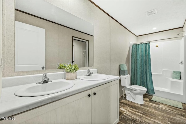 full bathroom with vanity, toilet, wood-type flooring, and shower / tub combo with curtain