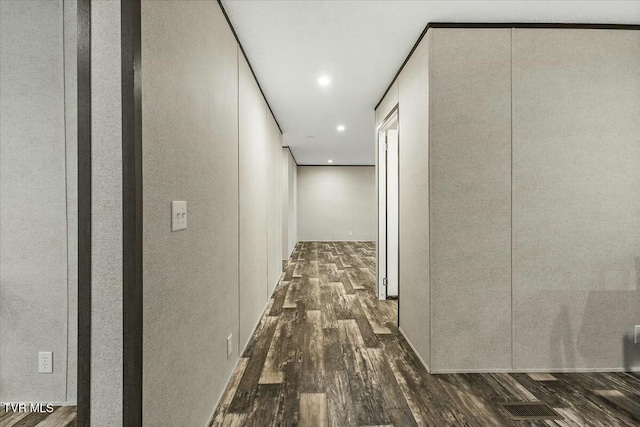 hallway with dark hardwood / wood-style floors