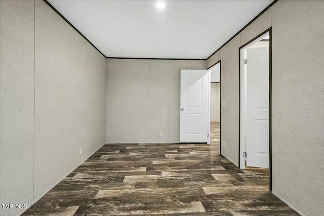 spare room featuring dark wood-type flooring